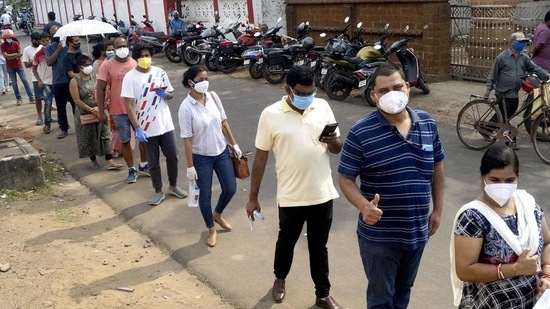 People stand in a queue to receive the dose of the Covid-19 vaccine during a vaccination drive above 18 years old. (ANI file photo)