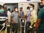 Volunteers carry oxygen cylinders for Covid-19 affected patients, at a city hospital in Ranchi. 