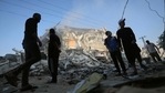 Palestinian men stand amidst debris near the al-Sharouk tower, which housed the bureau of the Al-Aqsa television channel in the Hamas-controlled Gaza Strip, after it was destroyed by an Israeli airstrike, in Gaza City, on May 13, 2021. (Mohammed Abed / AFP) Palestinian men stand amidst debris near the al-Sharouk tower, which housed the bureau of the Al-Aqsa television channel in the Hamas-controlled Gaza Strip, after it was destroyed by an Israeli airstrike, in Gaza City, on May 13, 2021. (Mohammed Abed / AFP)