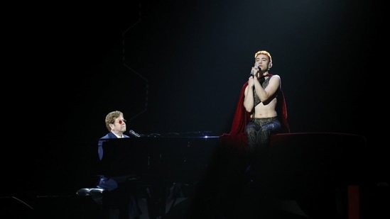 Olly Alexander and Elton John perform on stage at the BRIT Awards at the O2 Arena in London, Britain May 11, 2021.  (via REUTERS)