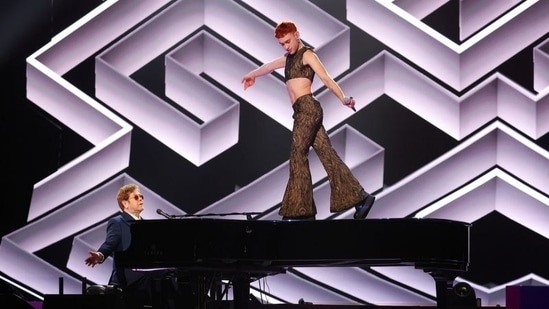 Olly Alexander and Elton John perform on stage at the BRIT Awards at the O2 Arena in London, Britain May 11, 2021.  (via REUTERS)