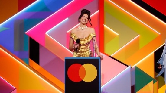 Singer Dua Lipa accepts the award at the BRIT Awards at the O2 Arena in London, Britain May 11, 2021.  (via REUTERS)