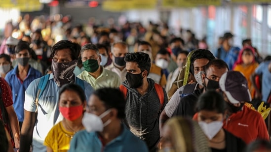 Passengers wait at a temperature checkpoint after arriving at Pune railway station during lockdown restrictions imposed by the state government in Pune, Maharashtra. (Bloomberg) Passengers wait at a temperature checkpoint after arriving at Pune railway station during lockdown restrictions imposed by the state government in Pune, Maharashtra. (Bloomberg)
