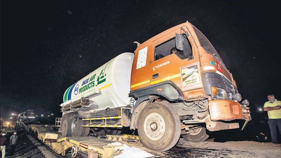 An oxygen tanker comes off the ramp after being unloaded from the “oxygen express” train at Loni, early on Wednesday morning. (PRATHAM GOKHALE/HT) An oxygen tanker comes off the ramp after being unloaded from the “oxygen express” train at Loni, early on Wednesday morning. (PRATHAM GOKHALE/HT)