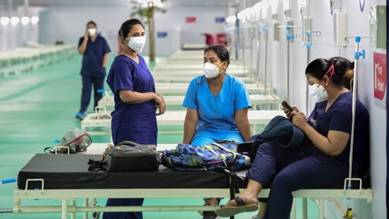 Health workers at the 500 ICU bed Covid-19 Care Centre at Ramlila Maidan opposite GTB hospital in New Delhi, on May 11. In comparison, on the evening of April 16, only 443 of the 3,989 ICU beds for Covid-19 patients were vacant, putting the vacancy at 87.9%, HT reported.(Kamal Kishore / PTI)