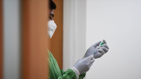A medical worker prepares a dose of the Covishield, AstraZeneca-Oxford's Covid-19 coronavirus vaccine, at Max hospital.( AFP) A medical worker prepares a dose of the Covishield, AstraZeneca-Oxford's Covid-19 coronavirus vaccine, at Max hospital.( AFP)