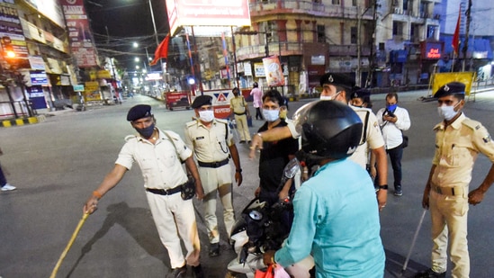 Patna: Bihar Police check vehicles during night curfew imposed to curb the spread of Covid-19 cases, in Patna, April 20, 2021. (PTI)