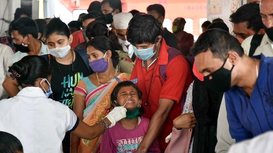 A health worker collects swab sample from a passenger arriving from Maharashtra by a special train at a COVID-19 testing counter, at Patna Railway Station in Patna. (PTI) A health worker collects swab sample from a passenger arriving from Maharashtra by a special train at a COVID-19 testing counter, at Patna Railway Station in Patna. (PTI)