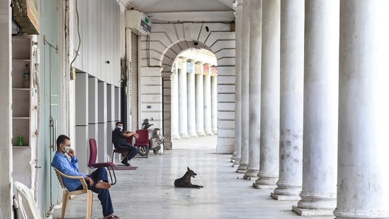 Connaught Place wears a deserted look during the ongoing lockdown imposed to curb the spread Covid-19, in New Delhi. (PTI) Connaught Place wears a deserted look during the ongoing lockdown imposed to curb the spread Covid-19, in New Delhi. (PTI)