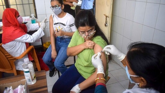 A medic is administering vaccine dose in Prayagraj. (PTI)
