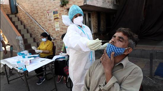 A health worker collects a nasal sample from a man for the COVID-19 test, in Jammu on (ANI) A health worker collects a nasal sample from a man for the COVID-19 test, in Jammu on (ANI)