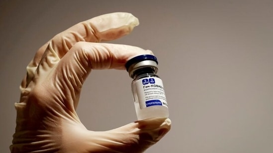 A medical specialist holds a vial of Sputnik V vaccine against the coronavirus in a department store in Moscow, Russia.(REUTERS)