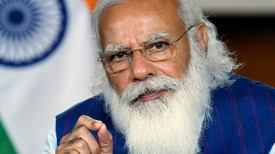 PM Modi called the coronavirus an 'invisible enemy' and urged people to continue taking precautions such as social distancing and using face masks to protect themselves and their families.(HT_PRINT) PM Modi called the coronavirus an 'invisible enemy' and urged people to continue taking precautions such as social distancing and using face masks to protect themselves and their families.(HT_PRINT)