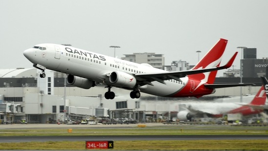A Qantas plane takes off from the Sydney International airport.(AFP) A Qantas plane takes off from the Sydney International airport.(AFP)
