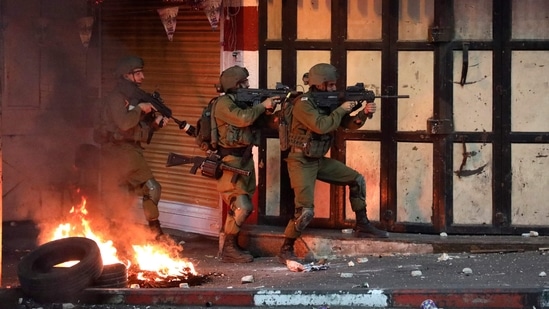 The Israeli army said its overnight assault on Gaza involved fighter jets and tanks hitting a Hamas tunnel network dug under civilian areas. (AFP) The Israeli army said its overnight assault on Gaza involved fighter jets and tanks hitting a Hamas tunnel network dug under civilian areas. (AFP)