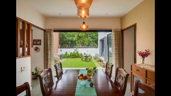 The two-storey, 4,200-sq-ft home of flowing spaces and natural light faces a lush lawn and garden that act as a physical extension of the dining space and a visual extension of the living area and four bedrooms. (Photos: Shamanth Patil J) The two-storey, 4,200-sq-ft home of flowing spaces and natural light faces a lush lawn and garden that act as a physical extension of the dining space and a visual extension of the living area and four bedrooms. (Photos: Shamanth Patil J)