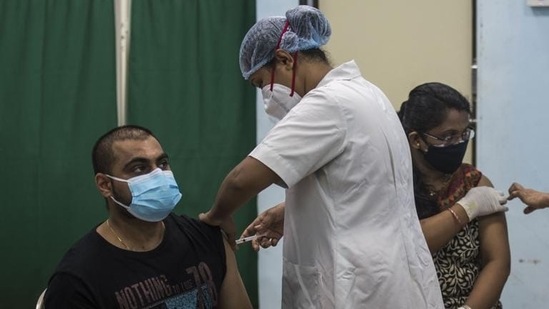 Beneficiaries receiving vaccine shots in Mumbai. (Photo by Pratik Chorge/Hindustan Times)