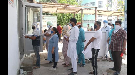 People waiting for their turn to get tested in Bathinda on Friday. People waiting for their turn to get tested in Bathinda on Friday.