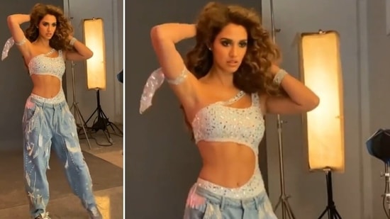 The actor looked to-die-for in this embellished bodysuit. She donned a shimmery white one shoulder bodycon top which was teamed with baggy denims and grey sneakers. (Instagram/@dishapatani)