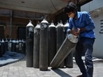 A worker keeps oxygen cylinders ready outside a Covid-19 Ward at Thane Civil Hospital, in Thane, Mumbai.
