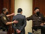 Victor Hugo Cuevas, a 26-year-old linked to a missing tiger named India, is taken into custody after his bond in a separate murder charge was revoked.(AP) Victor Hugo Cuevas, a 26-year-old linked to a missing tiger named India, is taken into custody after his bond in a separate murder charge was revoked.(AP)