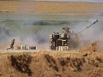 An Israeli artillery unit fires toward targets in Gaza Strip, at the Israeli Gaza border, Saturday, May 15, 2021. (AP Photo/Ariel Schalit) An Israeli artillery unit fires toward targets in Gaza Strip, at the Israeli Gaza border, Saturday, May 15, 2021. (AP Photo/Ariel Schalit)