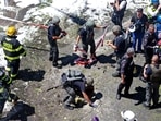Members of Israeli security and emergency services work on a site hit by a rocket in Ramat Gan near the coastal city of Tel Aviv. Members of Israeli security and emergency services work on a site hit by a rocket in Ramat Gan near the coastal city of Tel Aviv.