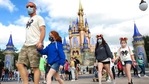 A family walks past Cinderella Castle in the Magic Kingdom, at Walt Disney World in Lake Buena Vista, Florida.(AP / File) A family walks past Cinderella Castle in the Magic Kingdom, at Walt Disney World in Lake Buena Vista, Florida.(AP / File)