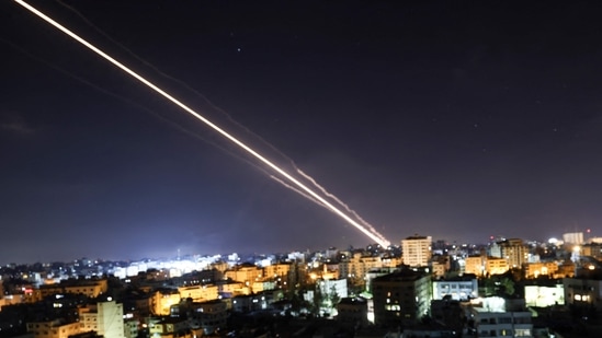 Rockets are launched from Gaza City, controlled by the Palestinian Hamas movement, towards Israel early on May 15, 2021.(AFP) Rockets are launched from Gaza City, controlled by the Palestinian Hamas movement, towards Israel early on May 15, 2021.(AFP)