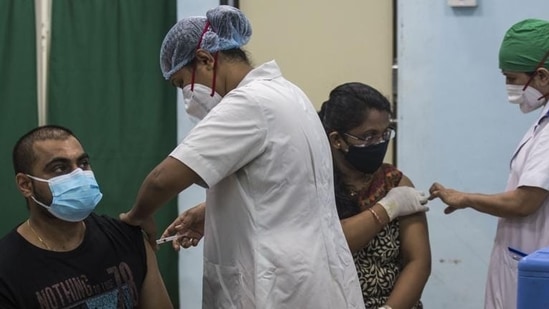 BMC medical staff inoculating Covishield vaccine to beneficiaries against Covid-19 at Rajawadi Hospital in Mumbai. (Pratik Chorge/HT file photo) BMC medical staff inoculating Covishield vaccine to beneficiaries against Covid-19 at Rajawadi Hospital in Mumbai. (Pratik Chorge/HT file photo)