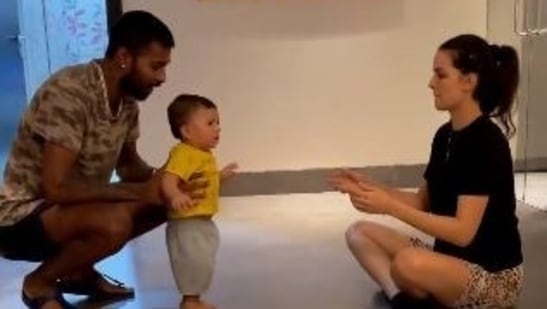 Natasa Stankovic and Hardik Pandya watch as their son Agastya takes his first steps.