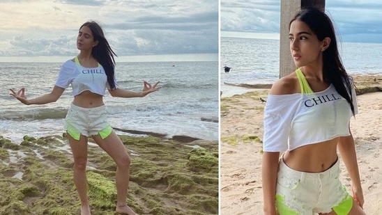 Sara Ali Khan posed by the shore in white cropped top and distressed shorts.(Instagram/@saraalikhan95)