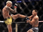 Charles Oliveira lands a kick against Michael Chandler during UFC 262 at Toyota Center.