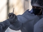 Healthcare workers prepare a dose of the Oxford-Astrazeneca Plc. Covid-19 vaccine, manufactured by Fiocruz, during a mass vaccination event in Botucatu, Brazil, on Sunday, May 16, 2021. A total of 57.1 million Covid vaccine doses have now been administered in Brazil, with an estimated rate of 945,574 doses per day. Photographer: Jonne Roriz/Bloomberg(Bloomberg) Healthcare workers prepare a dose of the Oxford-Astrazeneca Plc. Covid-19 vaccine, manufactured by Fiocruz, during a mass vaccination event in Botucatu, Brazil, on Sunday, May 16, 2021. A total of 57.1 million Covid vaccine doses have now been administered in Brazil, with an estimated rate of 945,574 doses per day. Photographer: Jonne Roriz/Bloomberg(Bloomberg)