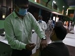 A health worker inoculates a man with a dose of Sinopharm vaccine against the Covid-19 coronavirus at a vaccination centre in Rawalpindi.(AFP) A health worker inoculates a man with a dose of Sinopharm vaccine against the Covid-19 coronavirus at a vaccination centre in Rawalpindi.(AFP)