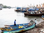 Fishermen anchored their boats at Versova beach due to formation of Cyclone Tauktae in the Arabian Sea, in Mumbai on Saturday,(PTI Photo) Fishermen anchored their boats at Versova beach due to formation of Cyclone Tauktae in the Arabian Sea, in Mumbai on Saturday,(PTI Photo)
