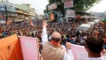 Union Home Minister Amit Shah waves his hand to the supporters during a roadshow, in Krishnanagar Uttar on Friday. (ANI Photo) Union Home Minister Amit Shah waves his hand to the supporters during a roadshow, in Krishnanagar Uttar on Friday. (ANI Photo)