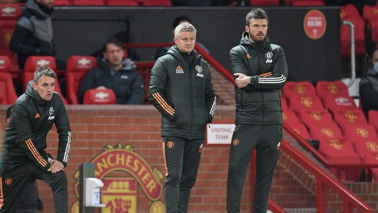 Manchester United manager Ole Gunnar Solskjaer and first team coach Michael Carrick. (Pool via REUTERS)