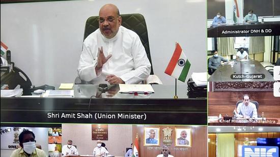 Union Home Minister Amit Shah chairs a review meeting with the CMs of Gujarat, Maharashtra and the Administrator of Daman and Diu and Dadra Nagar Haveli to deal with Cyclone Tauktae, in New Delhi on Sunday. (ANI PHOTO.) Union Home Minister Amit Shah chairs a review meeting with the CMs of Gujarat, Maharashtra and the Administrator of Daman and Diu and Dadra Nagar Haveli to deal with Cyclone Tauktae, in New Delhi on Sunday. (ANI PHOTO.)