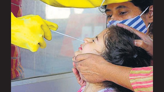 A child getting tested for Covid-19 at the Community Health Centre in Jawaddi, Ludhiana, on Sunday. (Harsimar Pal Singh/HT) A child getting tested for Covid-19 at the Community Health Centre in Jawaddi, Ludhiana, on Sunday. (Harsimar Pal Singh/HT)