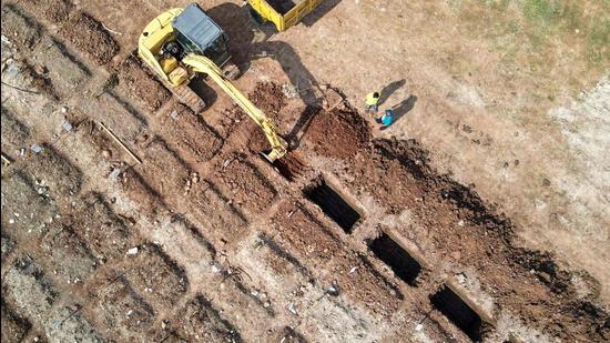 Graves being dug at a burial location for Covid-19 victims in Jakarta on May 13, 2021. (AFP)