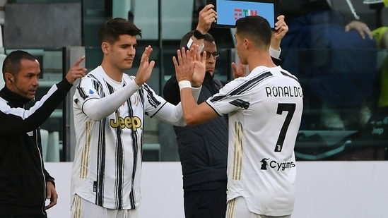 Juventus' Portuguese forward Cristiano Ronaldo (R) taps hands with Juventus' Spanish forward Alvaro Morata. (AFP) Juventus' Portuguese forward Cristiano Ronaldo (R) taps hands with Juventus' Spanish forward Alvaro Morata. (AFP)