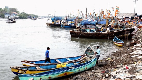 Fishermen anchored their boats at Versova beach due to formation of Cyclone Tauktae in the Arabian Sea, in Mumbai on Saturday,(PTI Photo)
