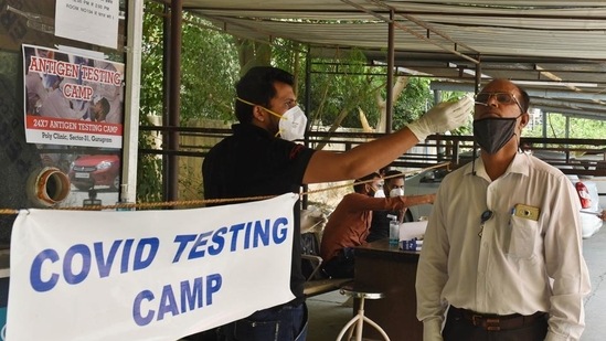 A man being tested for Covid-19 at the Polyclinic in Sector 31 in Gurugram. (HT Photo) A man being tested for Covid-19 at the Polyclinic in Sector 31 in Gurugram. (HT Photo)