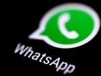 The icon of WhatsApp messaging application is seen on a phone screen.