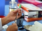A health worker prepares a dose of Covid-19 vaccine, at Suraj Mal Vihar Government school, in New Delhi on May 17, 2021. A health worker prepares a dose of Covid-19 vaccine, at Suraj Mal Vihar Government school, in New Delhi on May 17, 2021.