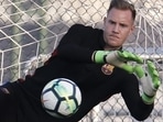 Barcelona's German goalkeeper Marc-Andre Ter Stegen jumps for a ball during a training session.(AFP)
