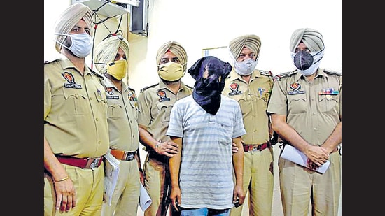 The accused in police custody in Ludhiana on Monday. (Gurpreet Singh/HT) The accused in police custody in Ludhiana on Monday. (Gurpreet Singh/HT)