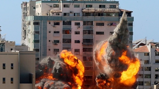 An explosion is seen near a tower housing AP, Al Jazeera offices during Israeli missile strikes in Gaza city, May 15. (Reuters)