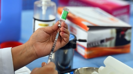 A health worker prepares a dose of Covid-19 vaccine, at Suraj Mal Vihar Government school, in New Delhi on May 17, 2021. (Raj K Raj/HT Photo)